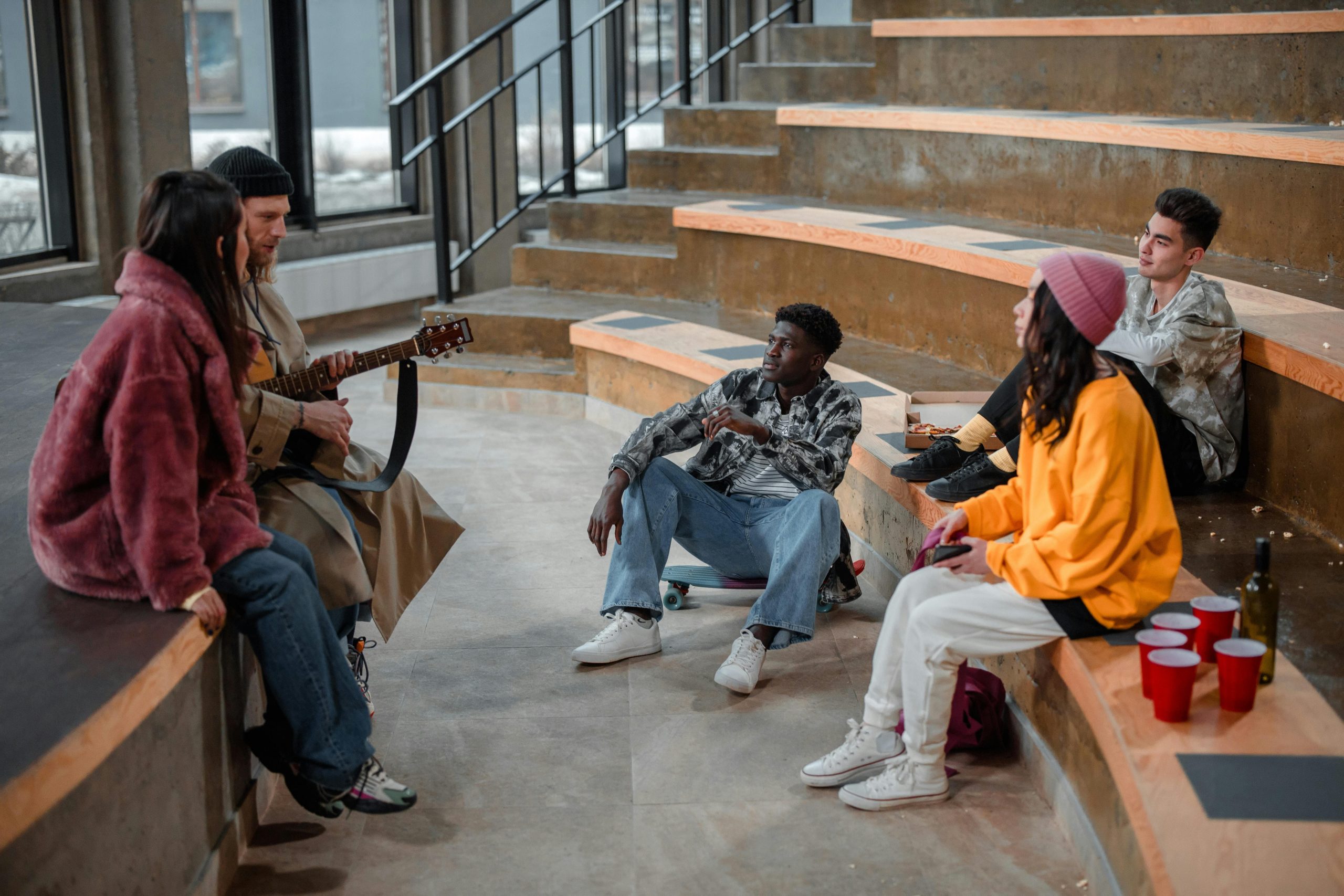 University students socializing in a modern campus common area