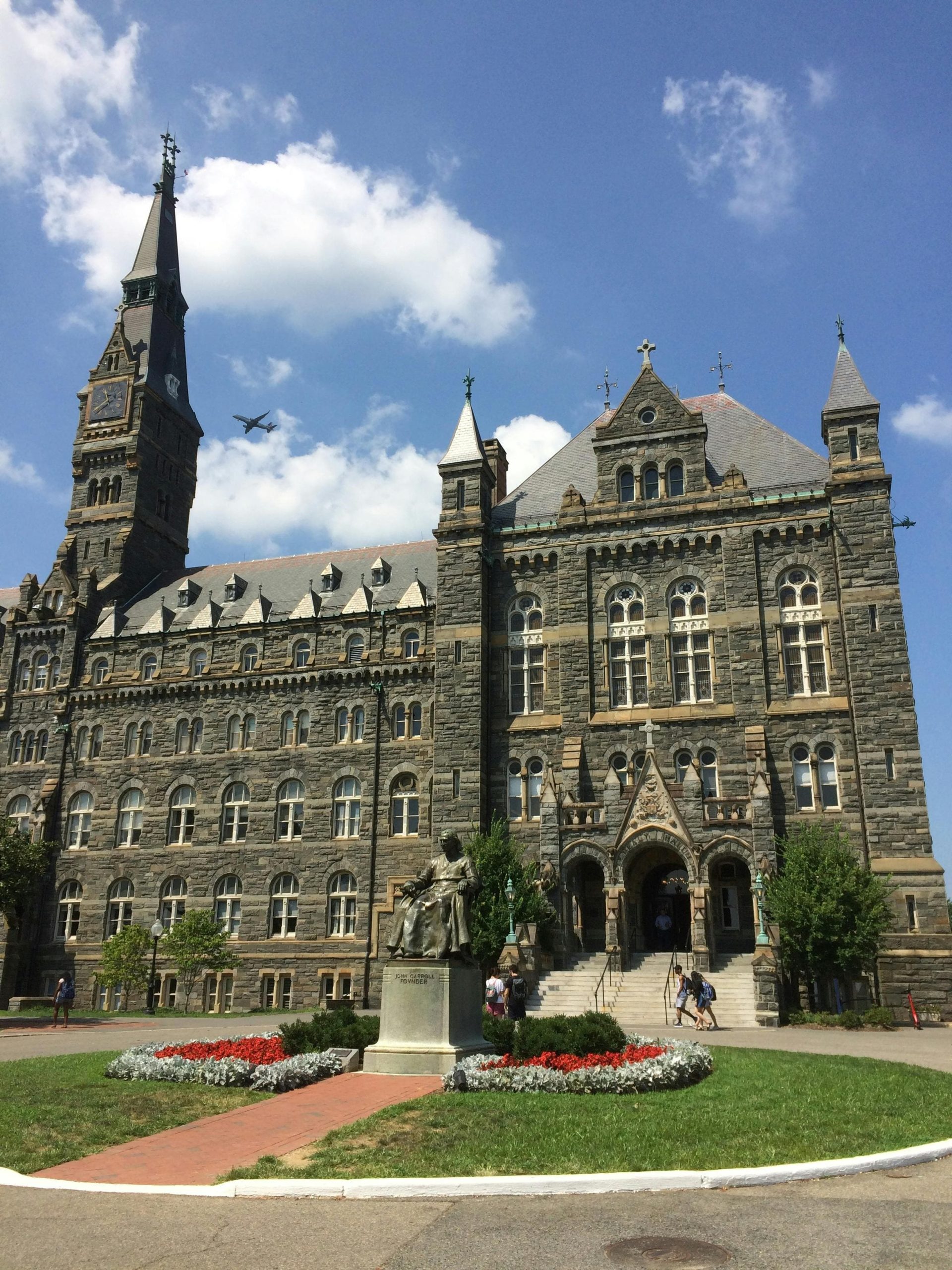 Historic university building with stone architecture and clock tower