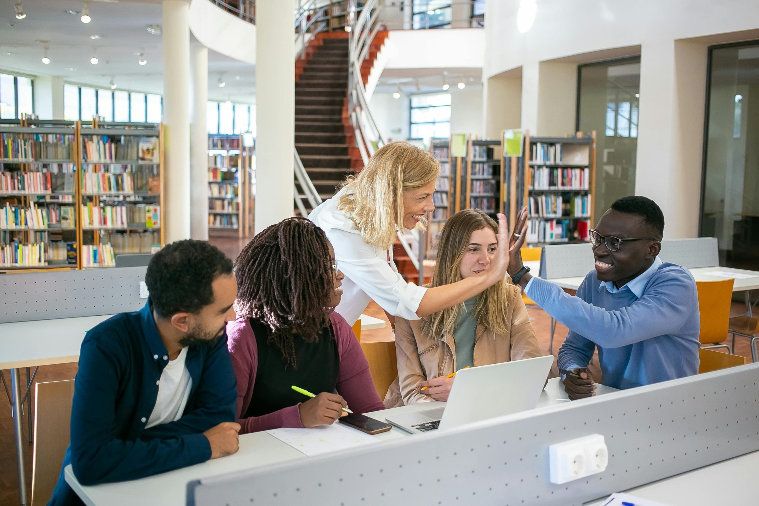 Students collaborating on a group project in a university library
