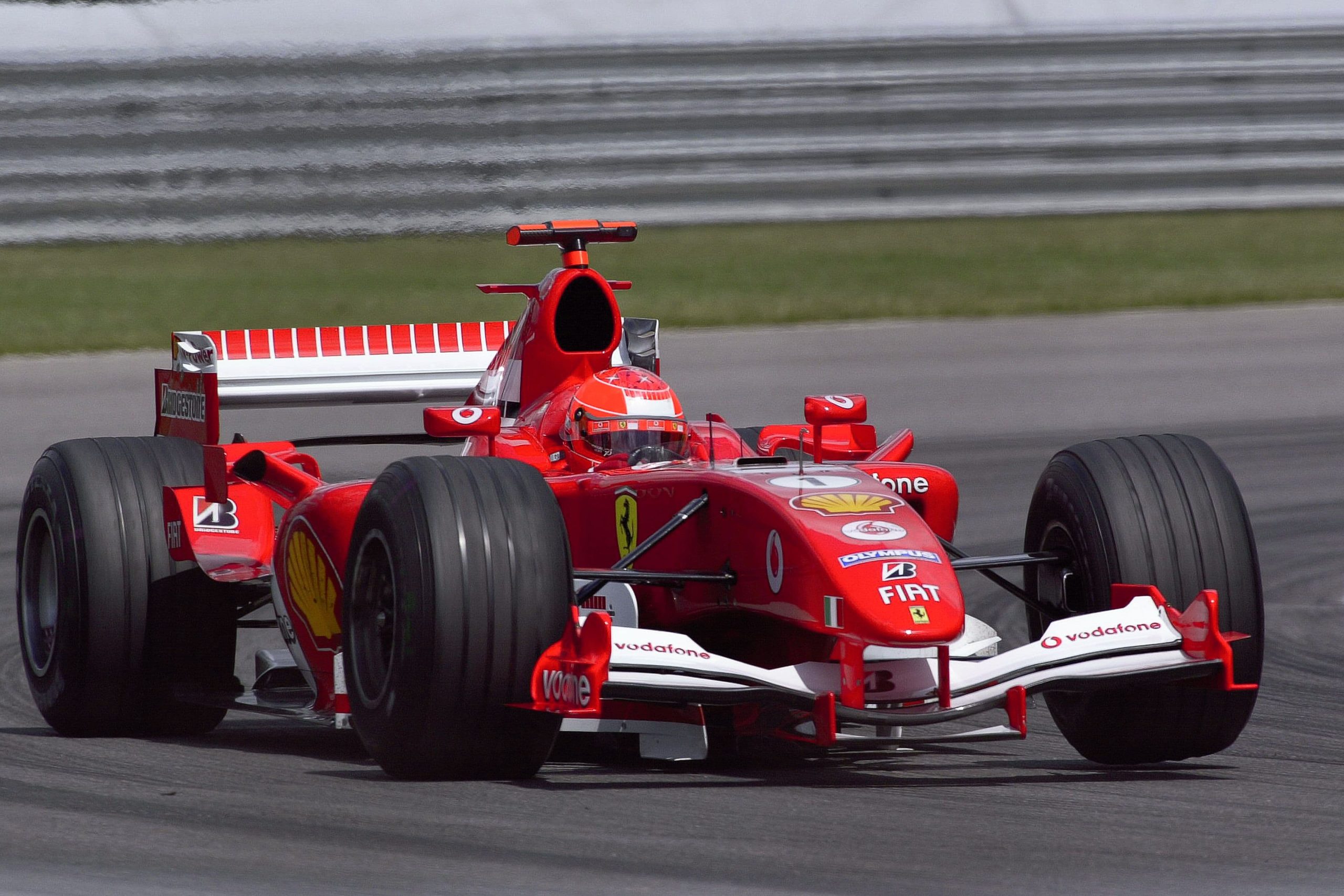 Ferrari Formula 1 race car with Bridgestone tires competing on track
